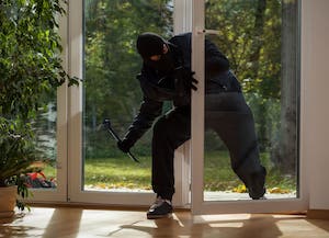 Thief Breaking Into House